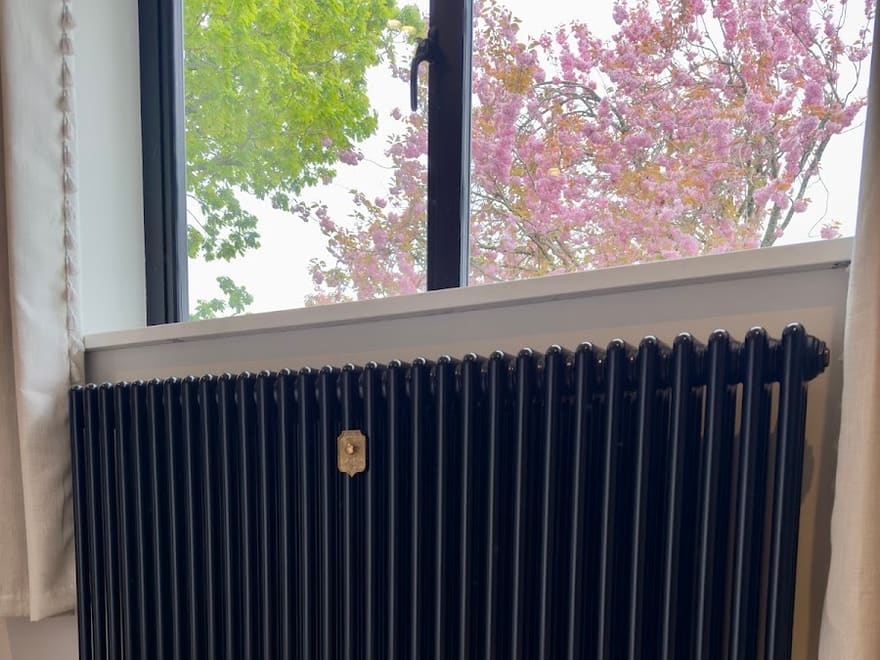 Navy column radiator installed by Lloyd in a period home, April 2025